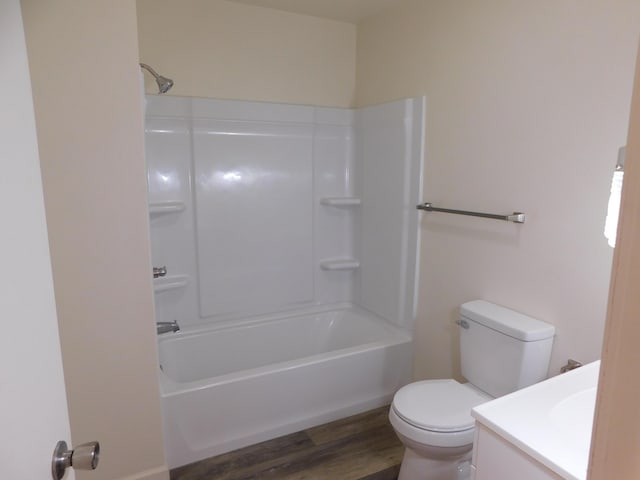 full bathroom with shower / bathtub combination, vanity, toilet, and hardwood / wood-style floors