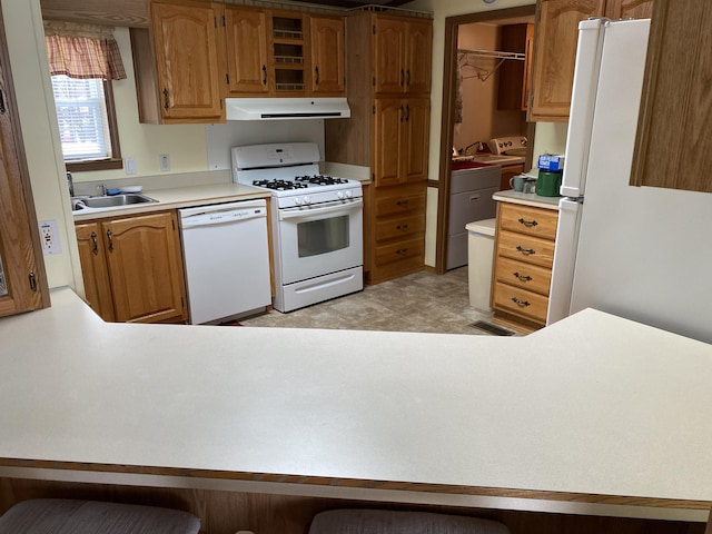 kitchen with sink and white appliances