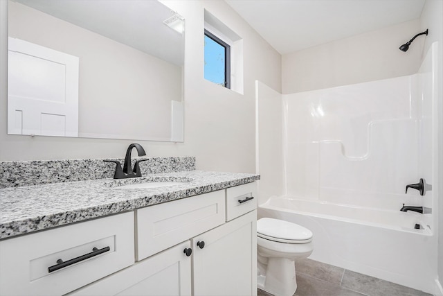 full bathroom with vanity, bathtub / shower combination, tile patterned floors, and toilet