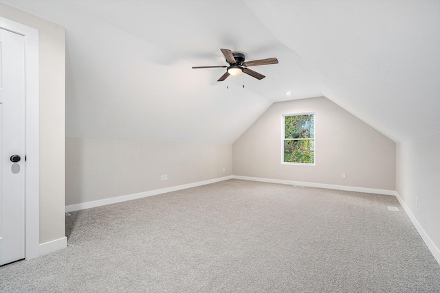 bonus room featuring ceiling fan, carpet flooring, and vaulted ceiling