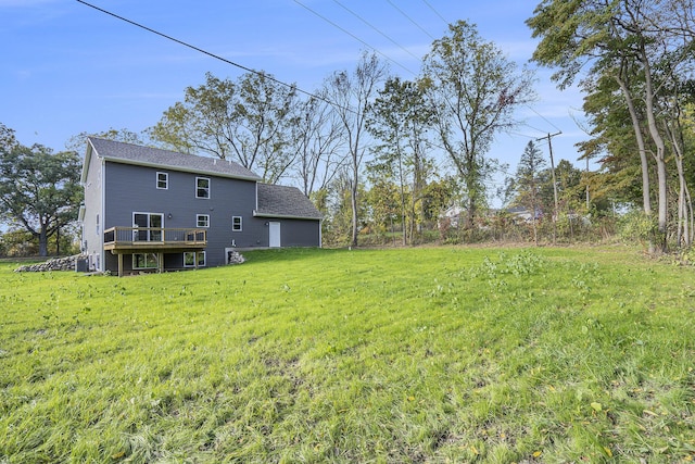 view of yard featuring a wooden deck