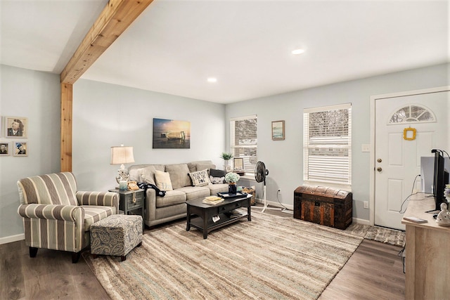 living room featuring beam ceiling and wood-type flooring