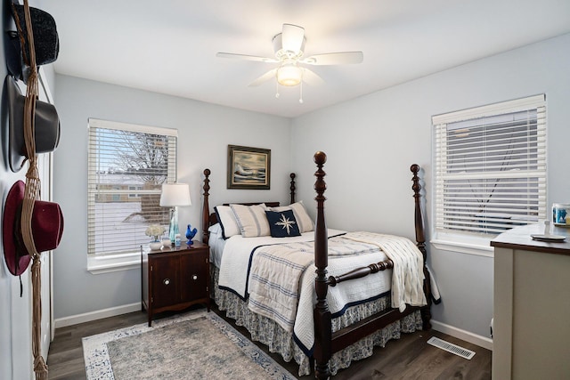 bedroom with dark wood-type flooring and ceiling fan