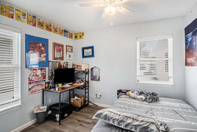 bedroom with hardwood / wood-style flooring and ceiling fan