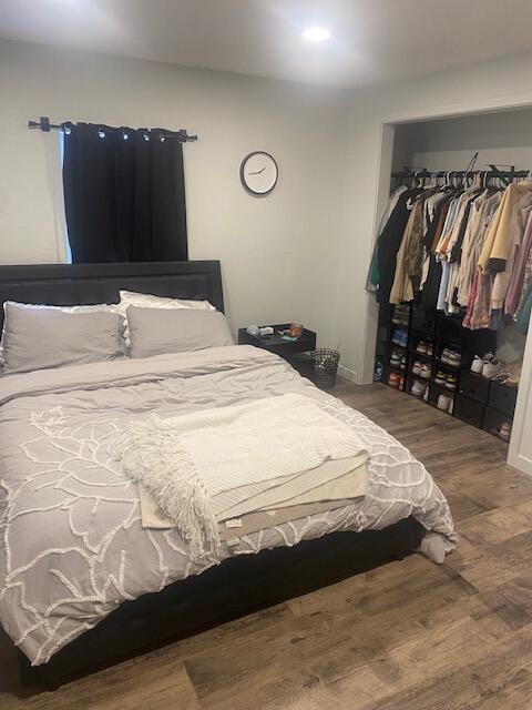 bedroom with wood-type flooring