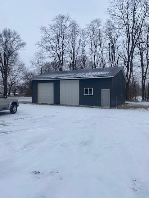 view of snow covered garage