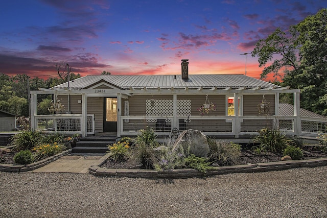 view of front of property featuring covered porch