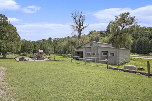 view of yard with an outbuilding and a playground