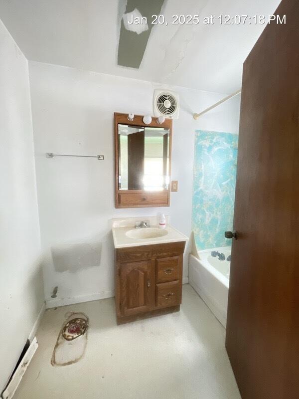 bathroom with vanity and shower / bathtub combination