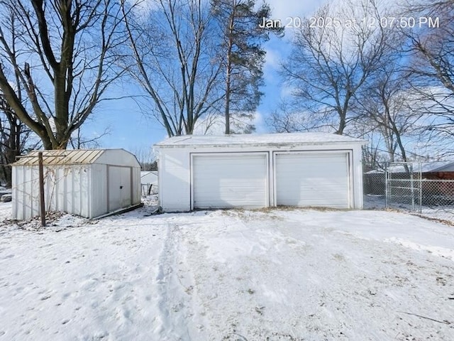 view of snow covered garage