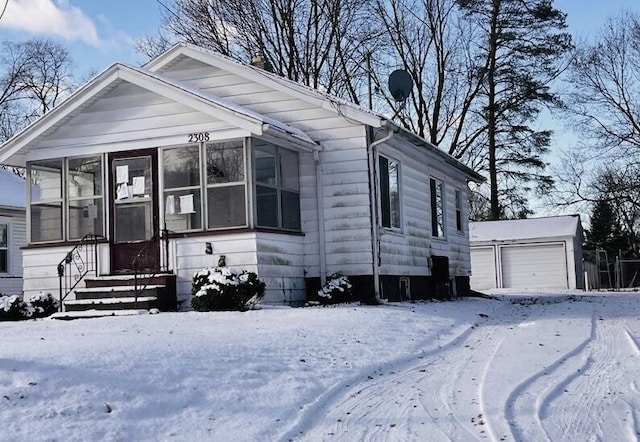 view of front of house featuring an outbuilding and a garage