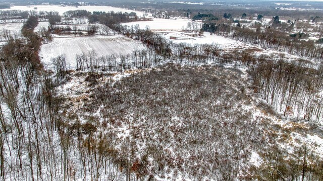 snowy aerial view with a rural view