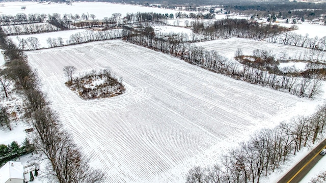 snowy aerial view with a rural view