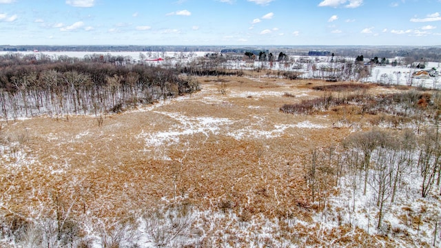 snowy aerial view with a rural view