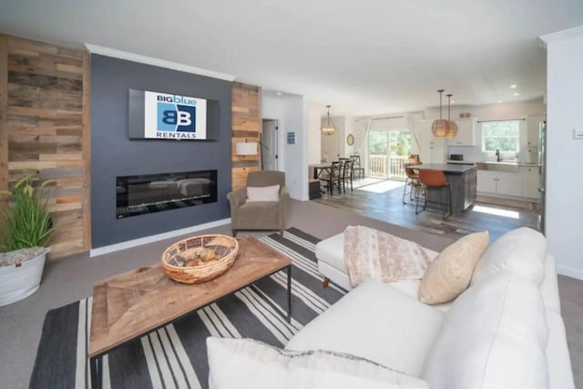 living room with a large fireplace and sink