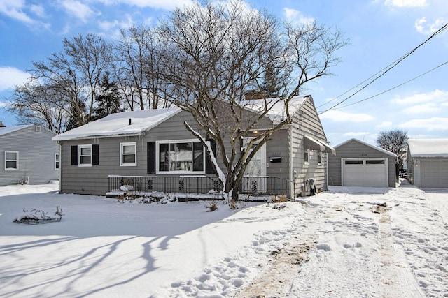 view of front facade featuring an outbuilding and a garage