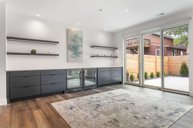 bar with dark wood-type flooring