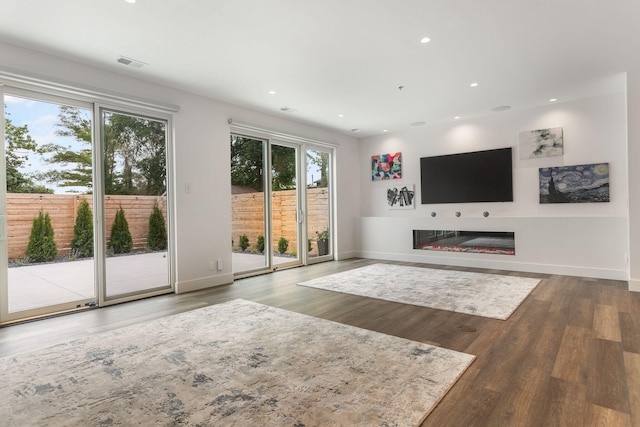 unfurnished living room with hardwood / wood-style floors