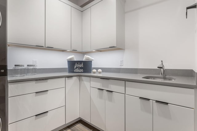 kitchen with sink and white cabinets