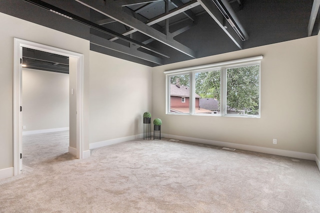 interior space featuring light carpet