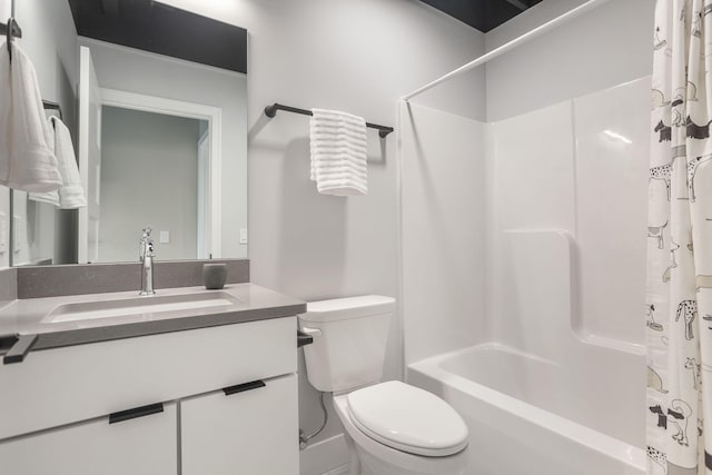 full bathroom with vanity, toilet, and shower / bath combo with shower curtain