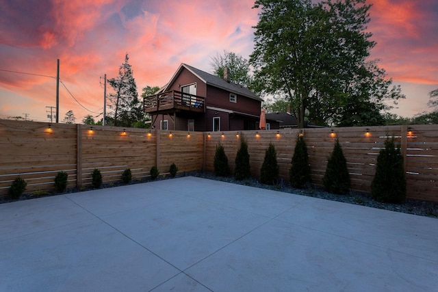 patio terrace at dusk with a balcony