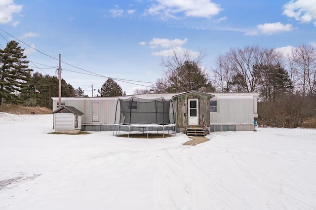 view of front of home with a trampoline