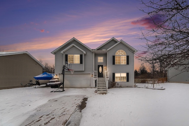 split foyer home featuring a garage