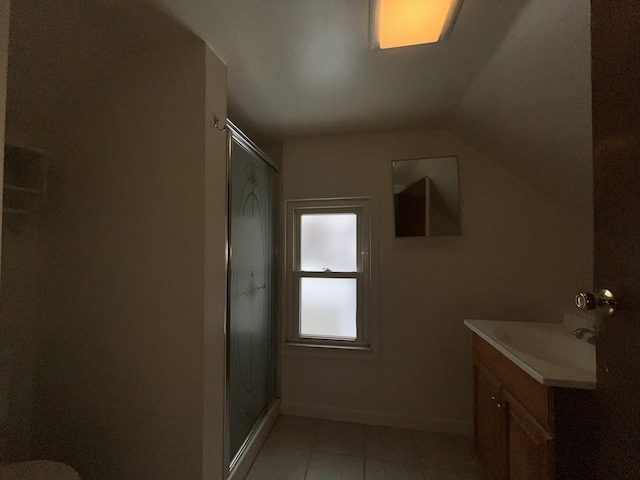 bathroom featuring vanity, an enclosed shower, and tile patterned flooring