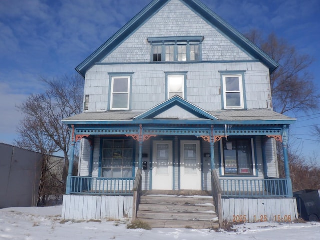 victorian house featuring a porch