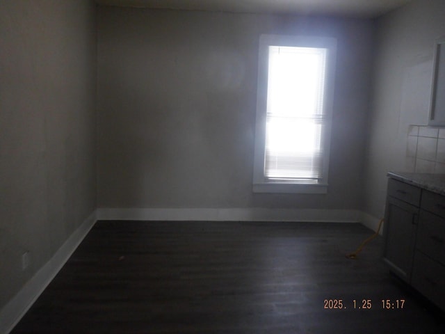 spare room featuring dark hardwood / wood-style floors