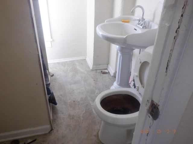 bathroom featuring toilet