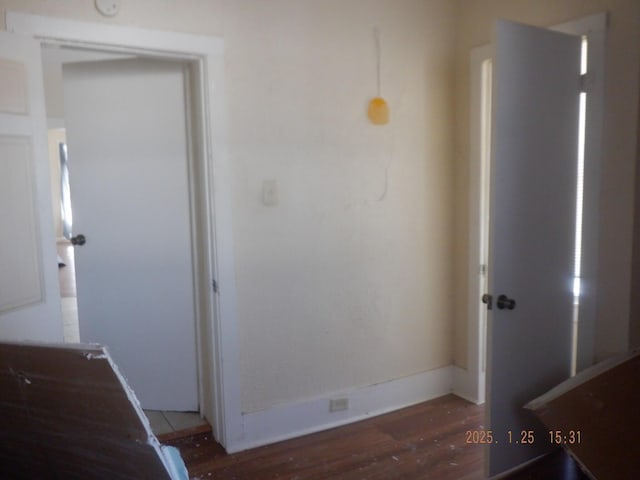 hallway featuring dark hardwood / wood-style floors