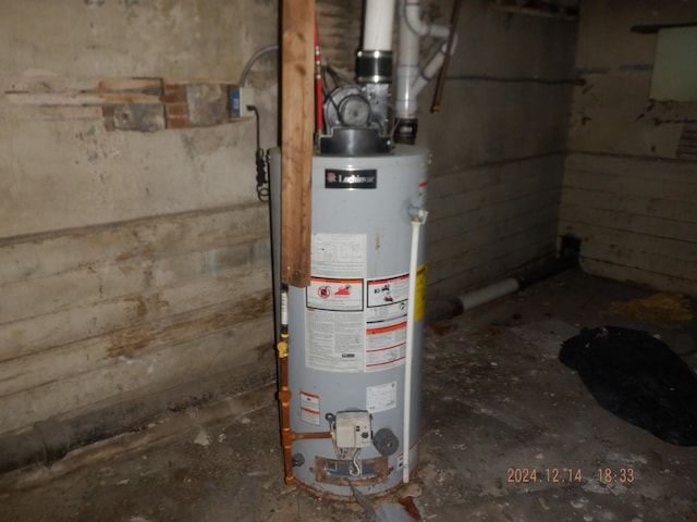 utility room with gas water heater