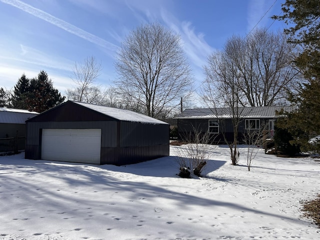 view of snow covered garage