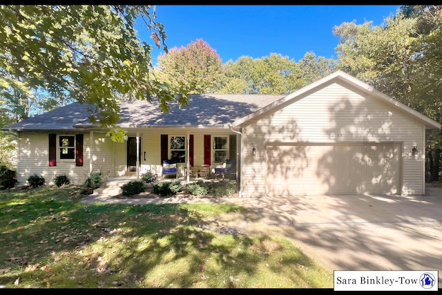 ranch-style home with a garage and covered porch