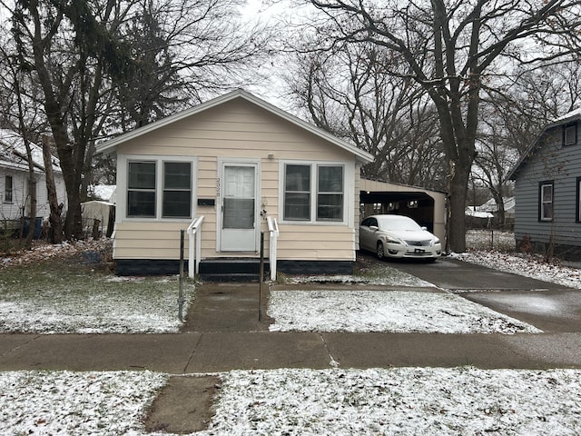 bungalow-style home featuring a carport