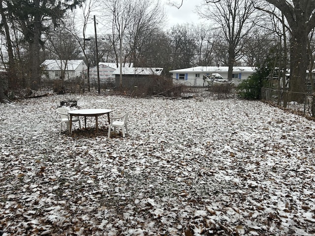 view of yard covered in snow