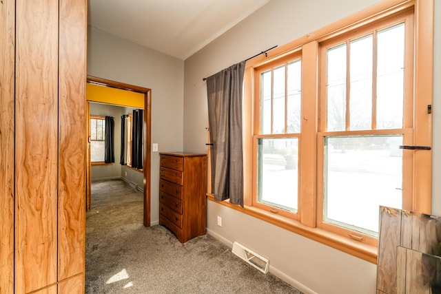 hallway with carpet floors