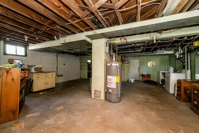 basement featuring water heater and washer and clothes dryer