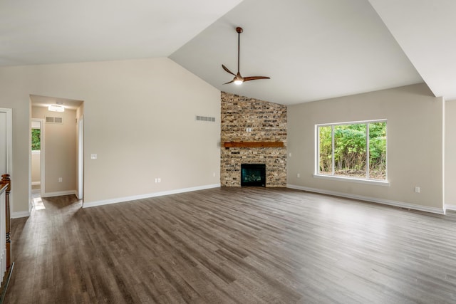 unfurnished living room with dark hardwood / wood-style flooring, a fireplace, high vaulted ceiling, and ceiling fan