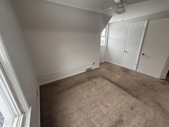 bonus room featuring carpet floors and ceiling fan