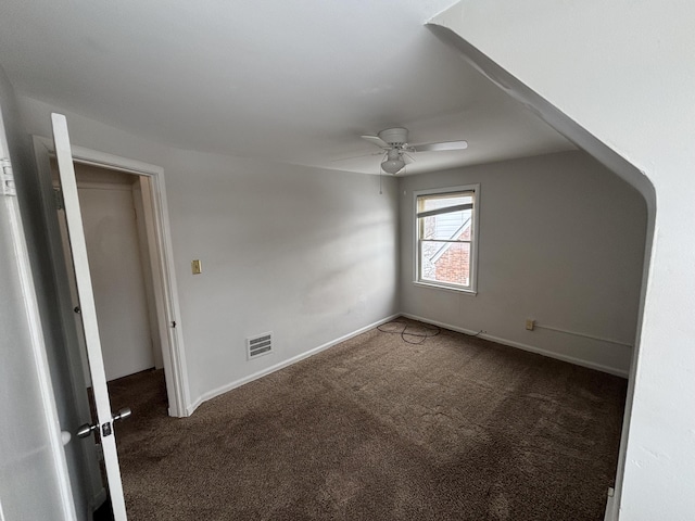 interior space with ceiling fan