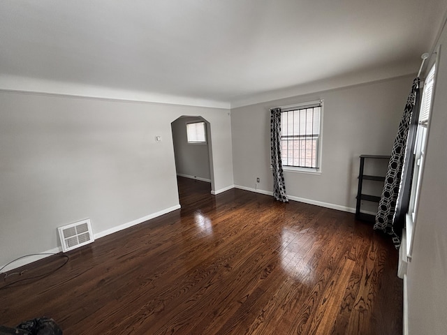 unfurnished room featuring dark hardwood / wood-style floors