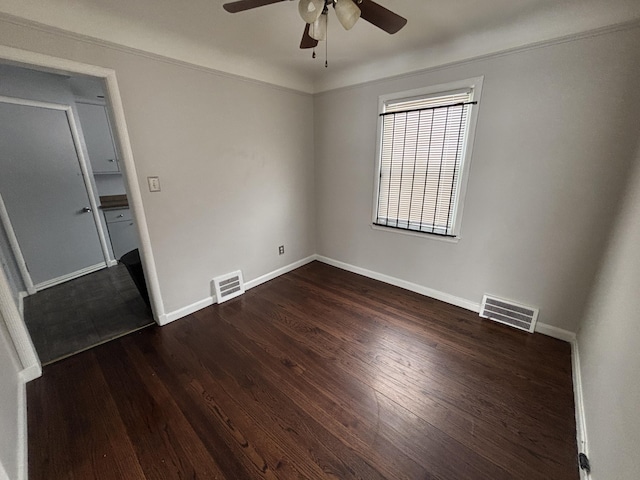 unfurnished bedroom with dark hardwood / wood-style floors and ceiling fan