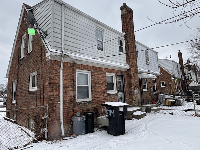 view of snow covered house