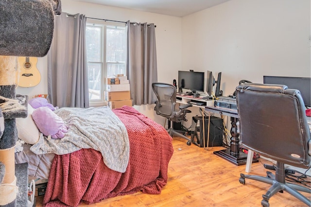 bedroom featuring hardwood / wood-style flooring