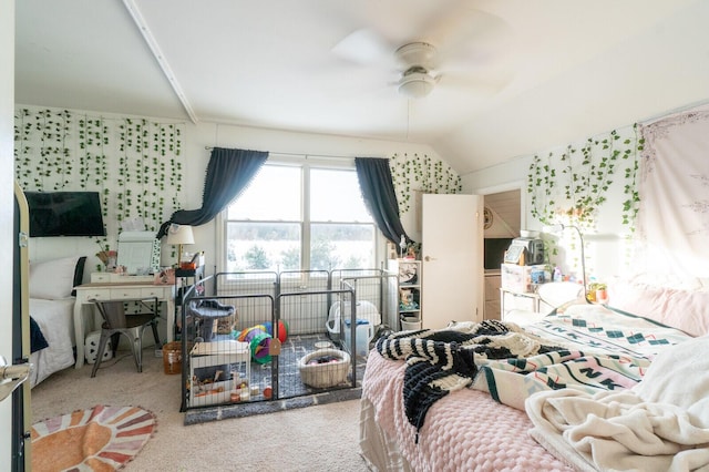 bedroom with ceiling fan, lofted ceiling, and carpet