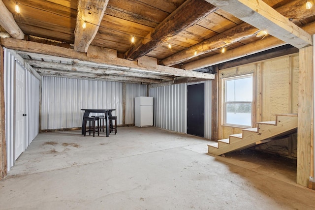 basement featuring white refrigerator