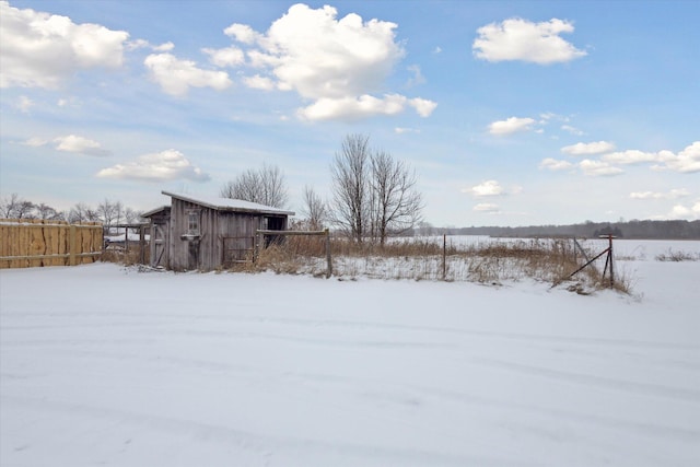 view of yard layered in snow